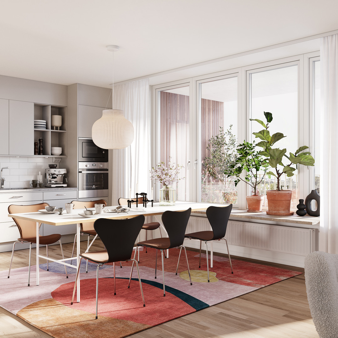 Vy över vardagsrum och kök med fin inredning